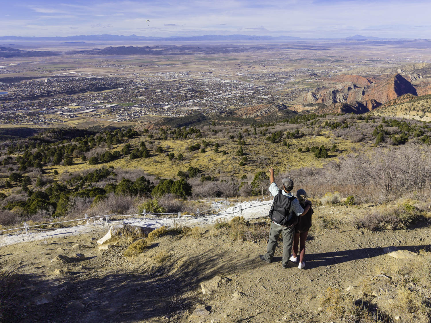 Two Hikers on Trail With View of Cedar City